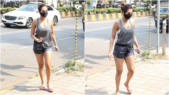 Malaika completed her ensemble with pink flip flops and a printed black face mask to keep herself safe amid the pandemic. She tied her locks in a sleek top knot, keeping the gym look fuss-free.(HT Photo/Varinder Chawla)