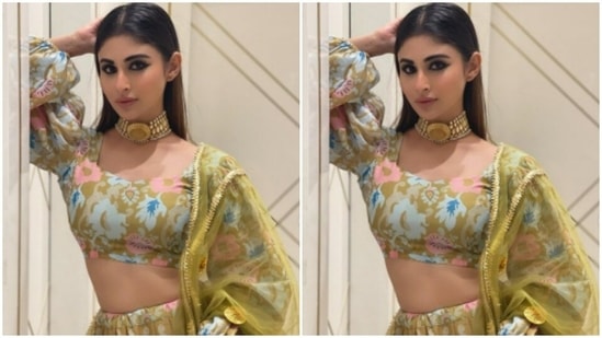 The midriff-baring blouse came with dramatic puff sleeves. Mouni teamed the blouse with a flowy skirt of multicoloured abstract prints.(Instagram/@imouniroy)