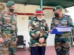 Prime Minister Narendra Modi interacts with senior army officials on his arrival to celebrate Diwali at Nowshera in Jammu and Kashmir (J&amp;K)'s Rajouri on Thursday.&nbsp;