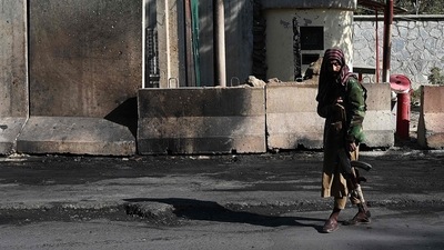A Taliban fighter stands guard outside the Sardar Mohammad Dawood Khan military hospital in Kabul on November 3, 2021. (AFP)