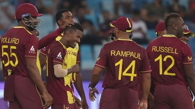 Dubai: West Indies' Akeal Hosein, 3rd left, celebrates after taking the wicket of England's Liam Livingstone caught and bowled during the Cricket T20 World Cup match between England and the West Indies at the Dubai International Cricket Stadium, in Dubai, UAE, Saturday, Oct. 23, 2021. AP/PTI(AP10_23_2021_000213B) (AP) Dubai: West Indies' Akeal Hosein, 3rd left, celebrates after taking the wicket of England's Liam Livingstone caught and bowled during the Cricket T20 World Cup match between England and the West Indies at the Dubai International Cricket Stadium, in Dubai, UAE, Saturday, Oct. 23, 2021. AP/PTI(AP10_23_2021_000213B) (AP)