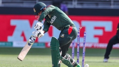 Bangladesh's Liton Das is out bowled by Australia's Mitchell Starc during the Cricket Twenty20 World Cup match between Australia and Bangladesh in Dubai, UAE, Thursday, Nov. 4, 2021. (AP) Bangladesh's Liton Das is out bowled by Australia's Mitchell Starc during the Cricket Twenty20 World Cup match between Australia and Bangladesh in Dubai, UAE, Thursday, Nov. 4, 2021. (AP)