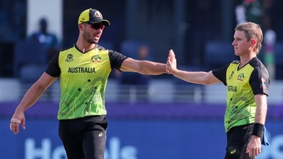 Australia's Adam Zampa, right, is congratulated by teammate Marcus Stoinis after taking the wicket of Bangladesh's Mustafizur Rahman during the Cricket Twenty20 World Cup match between Australia and Bangladesh in Dubai, UAE, Thursday, Nov. 4, 2021. (AP) Australia's Adam Zampa, right, is congratulated by teammate Marcus Stoinis after taking the wicket of Bangladesh's Mustafizur Rahman during the Cricket Twenty20 World Cup match between Australia and Bangladesh in Dubai, UAE, Thursday, Nov. 4, 2021. (AP)
