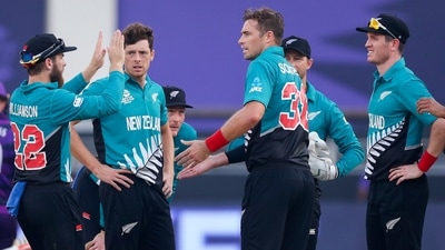 New Zealand's captain Kane Williamson, left, congratulates Tim Southee after he dismissed Scotland's Matthew Cross during the Cricket Twenty20 World Cup match between New Zealand and Scotland in Dubai, UAE, (AP) New Zealand's captain Kane Williamson, left, congratulates Tim Southee after he dismissed Scotland's Matthew Cross during the Cricket Twenty20 World Cup match between New Zealand and Scotland in Dubai, UAE, (AP)