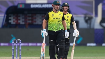 Australia's captain Aaron Finch, left, and teammate David Warner talk during the Cricket Twenty20 World Cup match between Australia and Bangladesh in Dubai, UAE, Thursday, Nov. 4, 2021. (AP) Australia's captain Aaron Finch, left, and teammate David Warner talk during the Cricket Twenty20 World Cup match between Australia and Bangladesh in Dubai, UAE, Thursday, Nov. 4, 2021. (AP)