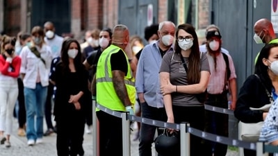 People queue to receive a vaccine against the coronavirus disease (COVID-19), during a night of vaccinations with music, at the Arena Treptow vaccination centre in Berlin, Germany (REUTERS) People queue to receive a vaccine against the coronavirus disease (COVID-19), during a night of vaccinations with music, at the Arena Treptow vaccination centre in Berlin, Germany (REUTERS)