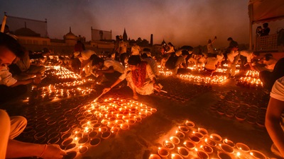 As many as 50,000 diyas were lit at the site of the Ram temple and the rest were lit in other temples across the state. (PTI) As many as 50,000 diyas were lit at the site of the Ram temple and the rest were lit in other temples across the state. (PTI)