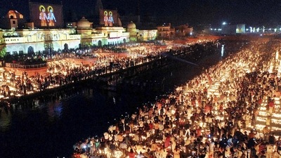 Devotees light earthen lamps on the bank of Saryu River during Deepotsav celebrations in Ayodhya. (PTI) Devotees light earthen lamps on the bank of Saryu River during Deepotsav celebrations in Ayodhya. (PTI)