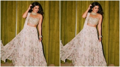 Priyanka teamed the blouse with a white flowy skirt with multicolour prints all over and completed her look with a white dupatta. (Instagram/@priyankachopra) Priyanka teamed the blouse with a white flowy skirt with multicolour prints all over and completed her look with a white dupatta. (Instagram/@priyankachopra)