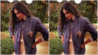 Rhea paired a white dhoti and a navy blue bandhgala and posed for the pictures. (Instagram/@rheakapoor) Rhea paired a white dhoti and a navy blue bandhgala and posed for the pictures. (Instagram/@rheakapoor)