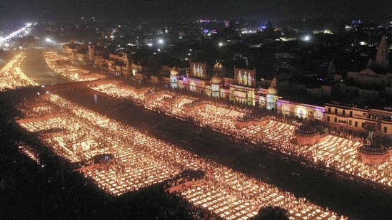 Devotees light earthen lamps on the bank of Saryu River during Deepotsav celebrations in Ayodhya.(PTI)