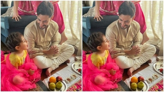 Kunal and Inaaya scooped out some time in between puja to share a smile.(Instagram/@kunalkemmu)