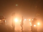 Commuters drive amid low visibility on Diwali at Narwana road as the pollution level rises, in New Delhi.(HT_PRINT) Commuters drive amid low visibility on Diwali at Narwana road as the pollution level rises, in New Delhi.(HT_PRINT)