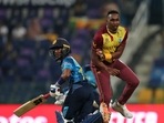 West Indies' Dwayne Bravo collides with Sri Lanka's Pathum Nissanka during the Cricket Twenty20 World Cup match between Sri Lanka and West Indies in Abu Dhabi, UAE West Indies' Dwayne Bravo collides with Sri Lanka's Pathum Nissanka during the Cricket Twenty20 World Cup match between Sri Lanka and West Indies in Abu Dhabi, UAE