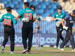 Sharjah: New Zealand's Ish Sodhi embraces teammate Devon Conway as captain Kane Williamson, left, runs in after taking the wicket of Namibia's captain Gerhard Erasmus, right, during the Cricket Twenty20 World Cup match between New Zealand and Namibia, in Sharjah, UAE, Friday, Nov. 5, 2021. AP/PTI(AP11_05_2021_000226A)(AP)