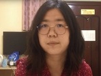 (FILES) This file screengrab taken on December 28, 2020 from an undated video showing former Chinese lawyer and citizen journalist Zhang Zhan as she broadcasts via YouTube, at an unconfirmed location in China. - Zhang, a citizen journalist jailed for her coverage of China's initial response to Covid in Wuhan, is close to death on November 5, 2021 after going on hunger strike, her family said, prompting renewed calls from rights groups for her immediate release. (AFP Photo) (FILES) This file screengrab taken on December 28, 2020 from an undated video showing former Chinese lawyer and citizen journalist Zhang Zhan as she broadcasts via YouTube, at an unconfirmed location in China. - Zhang, a citizen journalist jailed for her coverage of China's initial response to Covid in Wuhan, is close to death on November 5, 2021 after going on hunger strike, her family said, prompting renewed calls from rights groups for her immediate release. (AFP Photo)