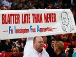 Fans hold a banner protesting against Sepp Blatter. (Getty)