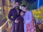 Kajol, Ajay Devgn and their son Yug Devgn pose for Diwali picture.
