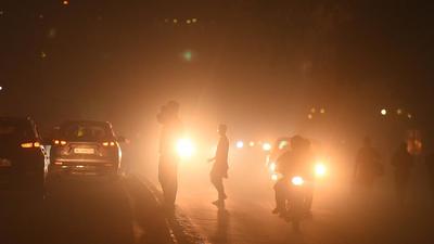Commuters drive amid low visibility on Diwali at Narwana road as the pollution level rises, in New Delhi. (Raj K Raj/HT Photo) Commuters drive amid low visibility on Diwali at Narwana road as the pollution level rises, in New Delhi. (Raj K Raj/HT Photo)