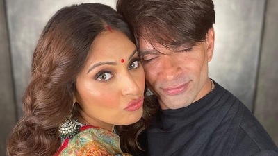 In one photo, Bipasha pouted as Karan smiled with his eyes closed. 