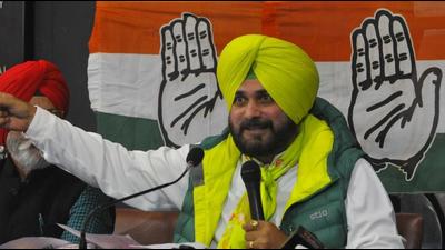 Punjab Congress chief Navjot Singh Sidhu addressing a press conference in Chandigarh on Friday. He reiterated his demand for the appointment of a new advocate general and director general of police. (Keshav Singh/HT)
