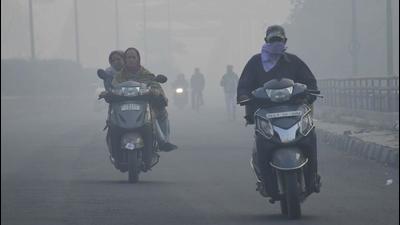 Commuters ply on their two-wheelers on a hazy morning witnessed on the next day of Diwali, in Ludhiana on Friday. (Harsimar Pal Singh/Hindustan Times) Commuters ply on their two-wheelers on a hazy morning witnessed on the next day of Diwali, in Ludhiana on Friday. (Harsimar Pal Singh/Hindustan Times)