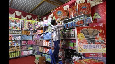 A shopkeeper arranges crackers at a shop for sale ahead of the Diwali festival, in Chennai. (PTI) A shopkeeper arranges crackers at a shop for sale ahead of the Diwali festival, in Chennai. (PTI)