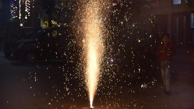 Noida, India - November 05, 2021: People burst firecrackers on Diwali, in Sector 22, Noida, India, on Friday, November 05, 2021. (Photo by Sunil Ghosh / Hindustan Times) Noida, India - November 05, 2021: People burst firecrackers on Diwali, in Sector 22, Noida, India, on Friday, November 05, 2021. (Photo by Sunil Ghosh / Hindustan Times)