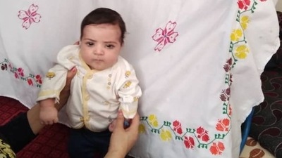 An Afghan refugee support group created a "Missing Baby" sign with Sohail's picture on it and are circulating it among their networks in the hopes that someone will recognize him. (VIA REUTERS)