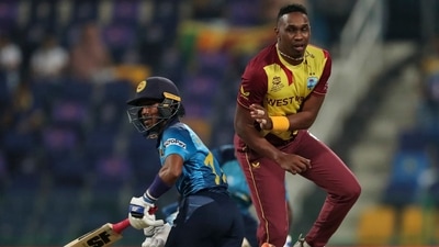 West Indies' Dwayne Bravo collides with Sri Lanka's Pathum Nissanka during the Cricket Twenty20 World Cup match between Sri Lanka and West Indies in Abu Dhabi, UAE (AP)
