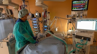 Head physician Lorenz Nowak treats a Covid-19 patient in the ICU of the Asklepios Clinic in Munich, Germany. (AP) Head physician Lorenz Nowak treats a Covid-19 patient in the ICU of the Asklepios Clinic in Munich, Germany. (AP)