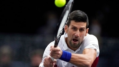 Novak Djokovic of Serbia returns the ball to U.S. Taylor Fritz during their quarterfinal match at the Paris Masters tennis tournament at the Accor Arena, in Paris, France, Friday, Nov. 5, 2021. (AP) Novak Djokovic of Serbia returns the ball to U.S. Taylor Fritz during their quarterfinal match at the Paris Masters tennis tournament at the Accor Arena, in Paris, France, Friday, Nov. 5, 2021. (AP)