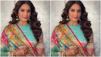 Bipasha teamed the long-sleeved blouse with a flowy skirt and a silk floral printed dupatta. (Instagram/@bipashabasu) Bipasha teamed the long-sleeved blouse with a flowy skirt and a silk floral printed dupatta. (Instagram/@bipashabasu)