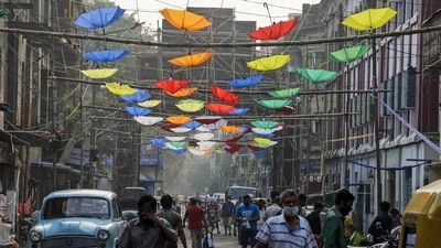 A road decorated with umbrellas during Diwali in Kolkata on Thursday. Kolkata’s air quality deteriorated as the city celebrated Kali Puja. (AP)