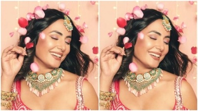 The pink lehenga is intricately embroidered in silver beads. The cold-shoulder sleeves of the blouse gave the outfit a sassy touch. (Instagram/@realhinakhan) The pink lehenga is intricately embroidered in silver beads. The cold-shoulder sleeves of the blouse gave the outfit a sassy touch. (Instagram/@realhinakhan)