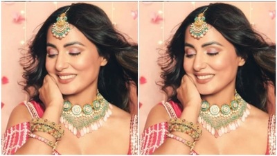 Hina played muse to designer house Pink Peacock Couture and picked this stunning ensemble from their wardrobe. Hina paired the blouse with a flowy skirt, embroidered in silver all over the body. (Instagram/@realhinakhan) Hina played muse to designer house Pink Peacock Couture and picked this stunning ensemble from their wardrobe. Hina paired the blouse with a flowy skirt, embroidered in silver all over the body. (Instagram/@realhinakhan)