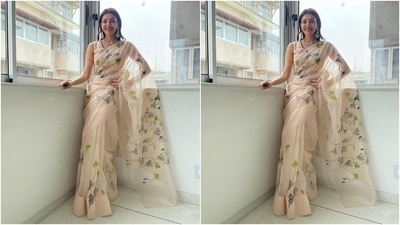 Kajal accessorised her traditional attire with a floral neckpiece, stone and pearl-adorned chandelier earrings, and rings. She kept her shoulder-length tresses, blow-dried to give a chic look, open in a centre-parting. (Instagram/@sayali_vidya) Kajal accessorised her traditional attire with a floral neckpiece, stone and pearl-adorned chandelier earrings, and rings. She kept her shoulder-length tresses, blow-dried to give a chic look, open in a centre-parting. (Instagram/@sayali_vidya)