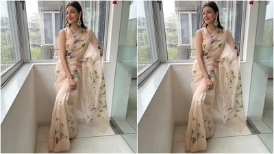 The couple decked up in traditional ensembles for the festivities. Kajal chose a stunning floral sheer saree from the label, Picchika, and Gautam looked dapper in a silk red bandhgala kurta and pyjama set. (Instagram/@sayali_vidya) The couple decked up in traditional ensembles for the festivities. Kajal chose a stunning floral sheer saree from the label, Picchika, and Gautam looked dapper in a silk red bandhgala kurta and pyjama set. (Instagram/@sayali_vidya)