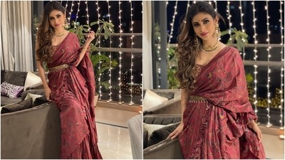 The Chinon chiffon and silk saree featured a crepe lining, semi-precious beads, sequence, cutdana, Resham, and pearl embroidery. The tiered hand-painted six yards also had ruched details on the pallu. (Instagram/@imouniroy)