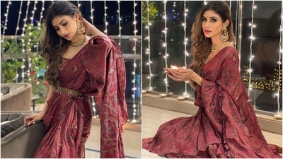 Mouni chose a pre-pleated ruffled saree from the shelves of the clothing label, Prints By Radhika, for Diwali 2021. The maroon hand-painted attire came adorned with ruffled details and intricate details that made it a standout piece. (Instagram/@imouniroy)