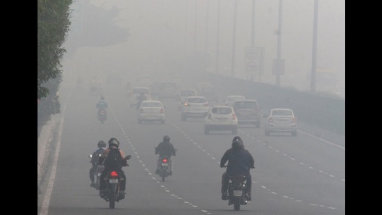 Vehicles plying amid low visibility due to smog post-Diwali in Gurugram on Friday. (ANI)