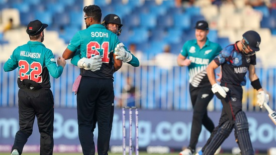 Sharjah: New Zealand's Ish Sodhi embraces teammate Devon Conway as captain Kane Williamson, left, runs in after taking the wicket of Namibia's captain Gerhard Erasmus, right, during the Cricket Twenty20 World Cup match between New Zealand and Namibia, in Sharjah, UAE, Friday, Nov. 5, 2021. AP/PTI(AP11_05_2021_000226A)(AP)