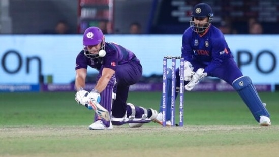 Scotland's George Munsey plays a reverse sweep during the Cricket Twenty20 World Cup match between India and Scotland in Dubai, UAE, Friday, Nov. 5, 2021. (AP Photo/Aijaz Rahi)(AP)