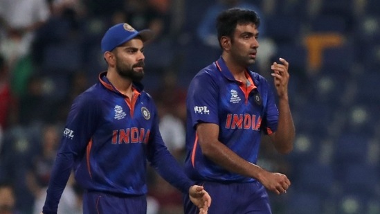 India's Ravichandran Ashwin, right, walks with captain Virat Kohli after dismissing Afghanistan's Najibullah Zadran during the Cricket Twenty20 World Cup match between India and Afghanistan in Abu Dhabi, UAE, Wednesday, Nov. 3, 2021. (AP)