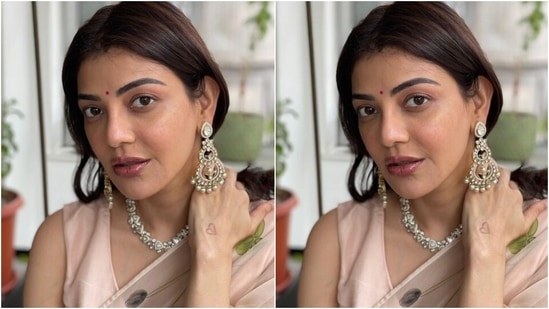 Kajal's beauty picks with the ethnic attire included a dainty red bindi, berry-toned lip shade, glowing skin, blushed cheeks, on-fleek eyebrows, and shimmery eye shadow. What do you think of Kajal's ethereal look?(Instagram/@sayali_vidya)