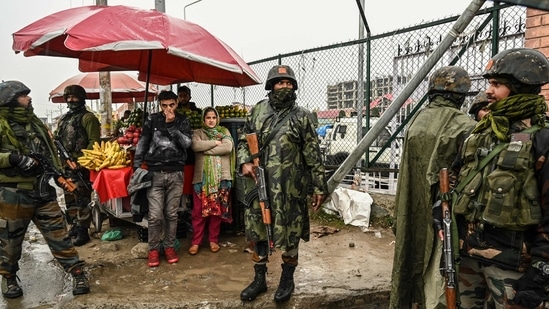 Indian army soldiers stand guard during a search operation reportedly conducted after a tip-off about the presence of suspected militants in Bemina area of Srinagar. (AFP)