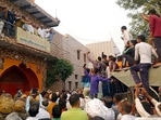 BJP leader Manish Grover and others were allegedly kept hostage by farmers for several hours at the Shiva temple in Rohtak's Kiloi village(Manoj Dhaka/ Hindustan Times) BJP leader Manish Grover and others were allegedly kept hostage by farmers for several hours at the Shiva temple in Rohtak's Kiloi village(Manoj Dhaka/ Hindustan Times)