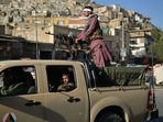 Taliban fighters patrol along a street in Kabul.(AFP) Taliban fighters patrol along a street in Kabul.(AFP)