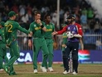 England's Mark Wood walks to congratulate South African cricketers after the latter won the Cricket Twenty20 World Cup match in Sharjah, UAE, Saturday, Nov. 6, 2021. England's Mark Wood walks to congratulate South African cricketers after the latter won the Cricket Twenty20 World Cup match in Sharjah, UAE, Saturday, Nov. 6, 2021.