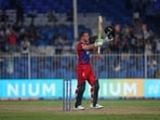England's Jos Buttler celebrates after scoring a century during the Cricket Twenty20 World Cup match between England and Sri Lanka in Sharjah, UAE, Monday, Nov. 1, 2021. (AP)